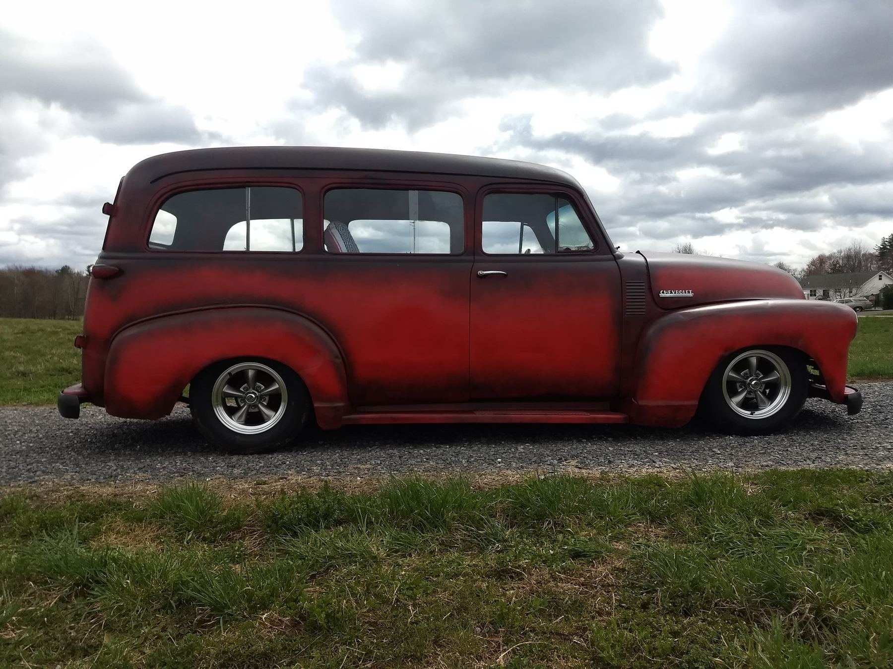 Red and black vintage Chevrolet panel truck